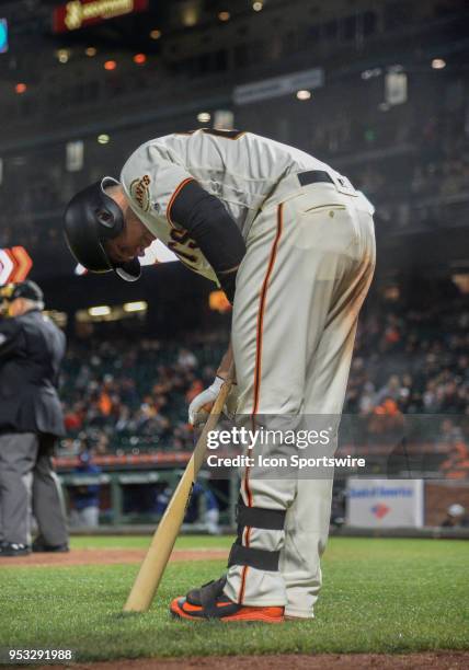 San Francisco Giants Catcher Buster Posey applies bat rosin during the San Francisco Giants and San Diego Padres game on April 30, 2018 at AT&T Park...