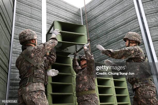 South Korean soldiers take down a propaganda loudspeakers on the border with North Korea on May 1, 2018 in Paju, South Korea. South Korea's military...
