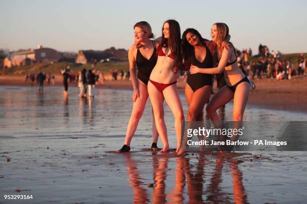 Students from the University of St Andrews take part in the traditional May Day Dip on the East Sands in St Andrews, Fife. Plunging into the freezing...