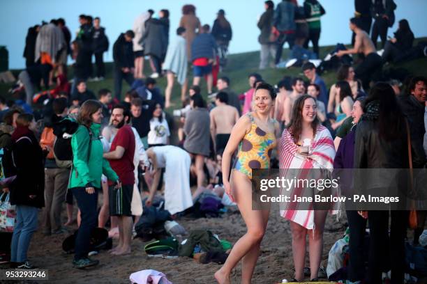 Students from the University of St Andrews take part in the traditional May Day Dip on the East Sands in St Andrews, Fife. Plunging into the freezing...