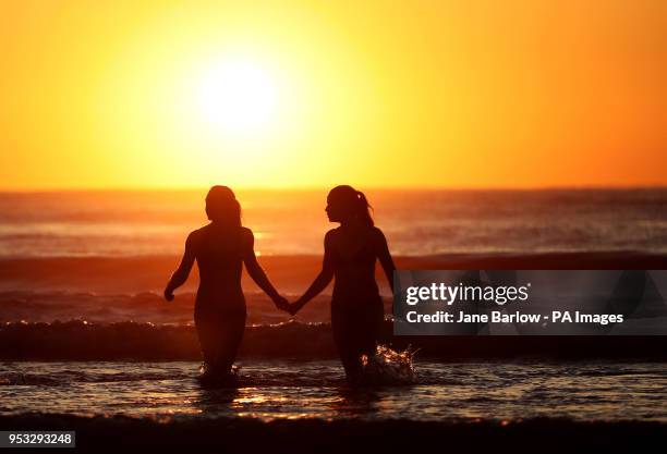 Students from the University of St Andrews take part in the traditional May Day Dip on the East Sands in St Andrews, Fife. Plunging into the freezing...