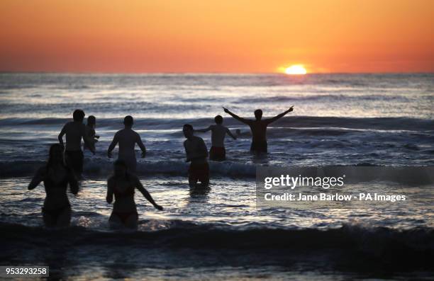 Students from the University of St Andrews take part in the traditional May Day Dip on the East Sands in St Andrews, Fife. Plunging into the freezing...