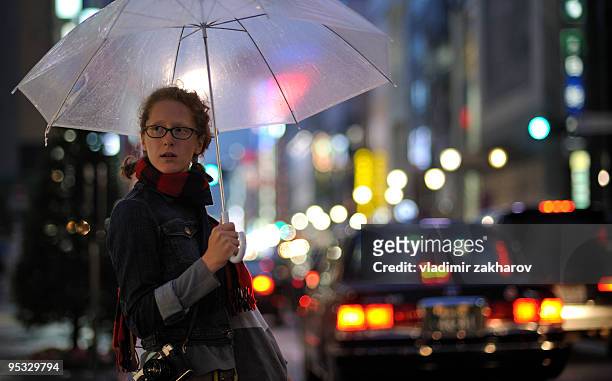 caucasian girl in tokyo - holding umbrella stock pictures, royalty-free photos & images