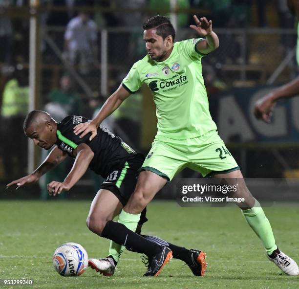 Juan Alejandro Maecha of La Equidad fights for the ball with Macnelly Torres of Atletico Nacional during match between La Equidad and Atletico...