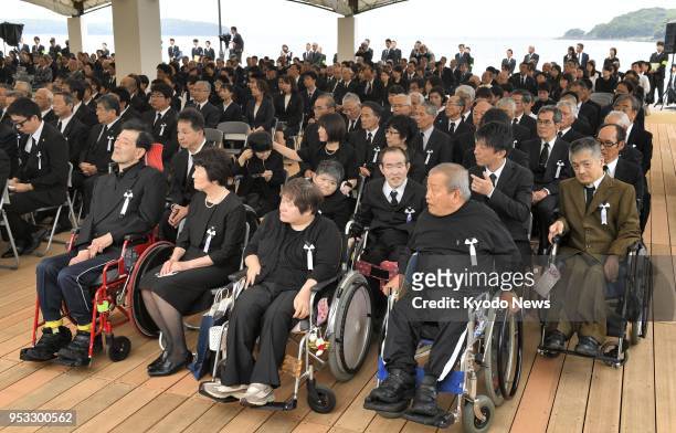 Patients of Minamata mercury-poisoning disease and family members of the victims attend a memorial service in the southwestern Japanese city of...