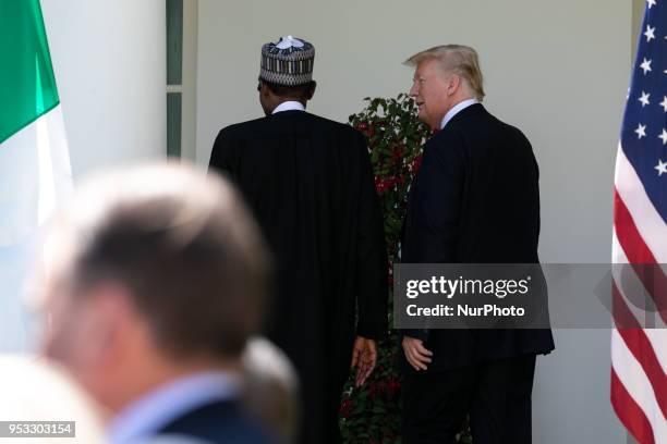 President Donald Trump , and Nigerian President Muhammadu Buhari, leave their joint press conference in the Rose Garden of the White House in...