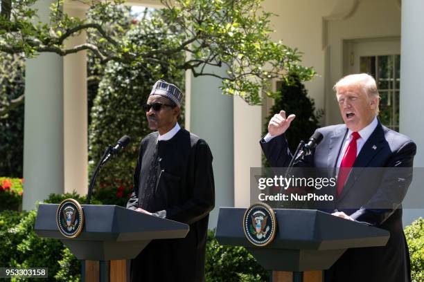 President Donald Trump , and President Muhammadu Buhari of the Federal Republic of Nigeria hold a joint press conference in the Rose Garden of the...