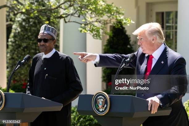 President Donald Trump , and President Muhammadu Buhari of the Federal Republic of Nigeria hold a joint press conference in the Rose Garden of the...