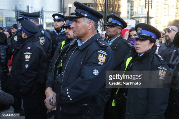 Transit enforcement officers were among the thousands of people attended an inter-faith vigil at Nathan Phillips Square in memory of the 10 people...