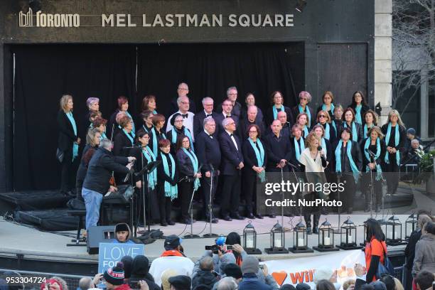 Choir performs as thousands of people attended an inter-faith vigil at Nathan Phillips Square in memory of the 10 people killed and 15 people injured...