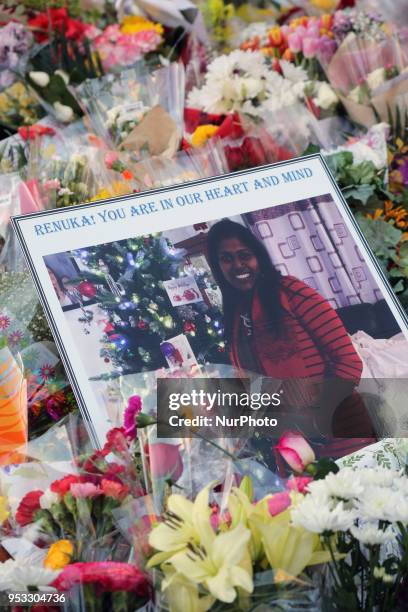 Flowers and messages at a memorial during an inter-faith vigil at Nathan Phillips Square in memory of the 10 people killed and 15 people injured in a...