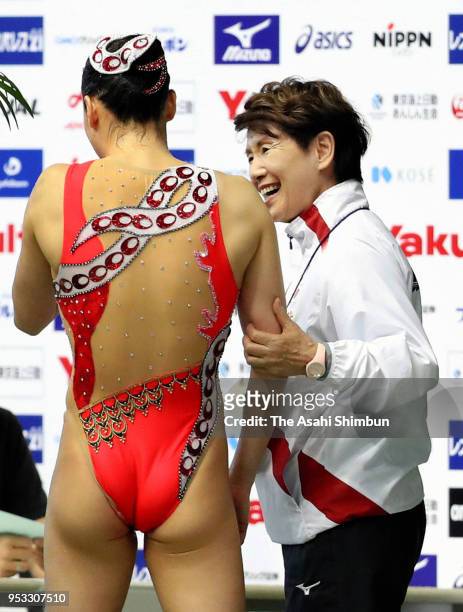 Yukiko Inui of Japan is congratulated by head coach Masayo Imura after competing in the Solo Free Routine final on day four of the FINA Artistic...
