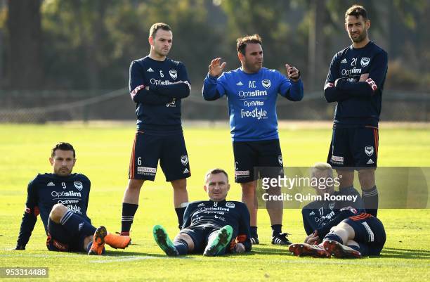 Kosta Barbarouses, Leigh Broxham, Besart Berisha, Anthony Crea, James Donachie and Carl Valeri of the Victory watch on during a Melbourne Victory...