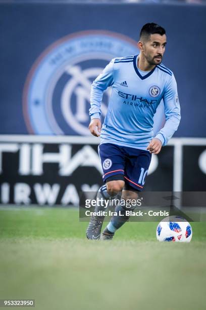 Maximiliano Moralez of New York City eyes the opening across the pitch with the NYCFC Logo behind him during the Major League Soccer match between...