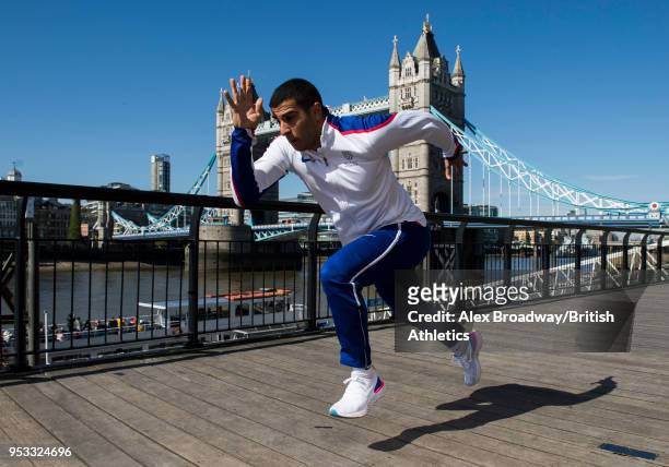 Adam Gemili of Great Britain poses for a photograph in front of Tower Bridge to announce that Athletics World Cup will showcase the first ever global...