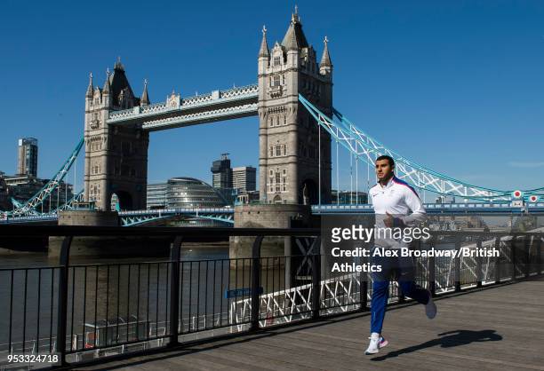 Adam Gemili of Great Britain poses for a photograph in front of Tower Bridge to announce that Athletics World Cup will showcase the first ever global...