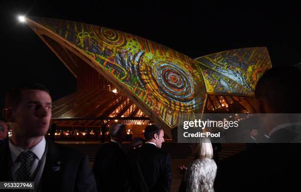 French President Emmanuel Macron meets with Australian Prime Minister Malcolm Turnbull and his wife Lucy Turnbull at the Sydney Opera House on May 1,...