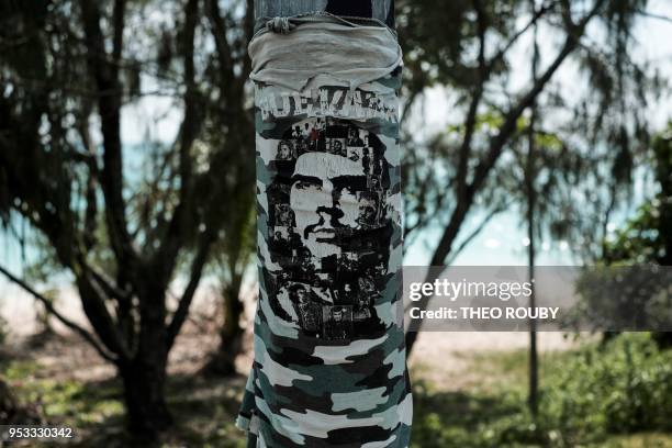 An image of revolutionary leader Ernesto 'Che' Guevara is seen on a lamp post on April 23 on Ouvea Island, on the French overseas territory of New...