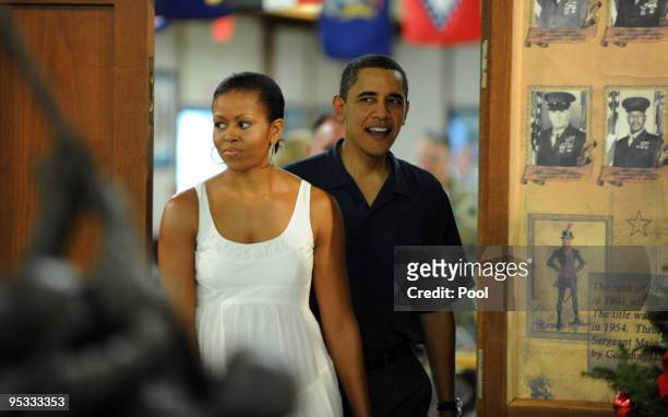 President Barack Obama and First Lady Michelle Obama enters the dining room at the Marine Corps Base Hawaii on December 25, 2009 in Kaneohe Bay,...