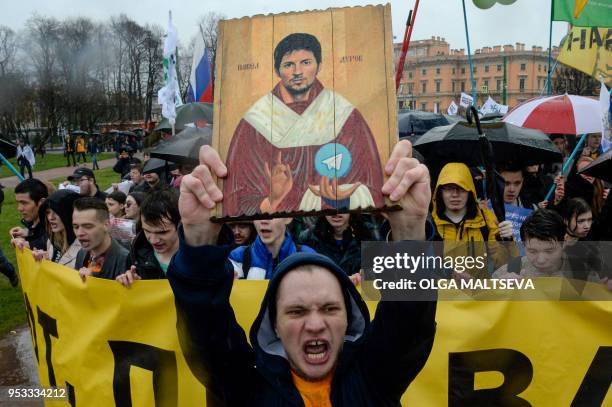Demonstrators with a icon stylised painting depicting Telegram's founder Pavel Durov protest against the blocking of the popular messaging app in...