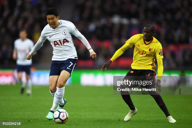 Son Heung-Min of Tottenham Hotspur gets away from Abdoulaye Doucoure of Watford during the Premier League match between Tottenham Hotspur and Watford...