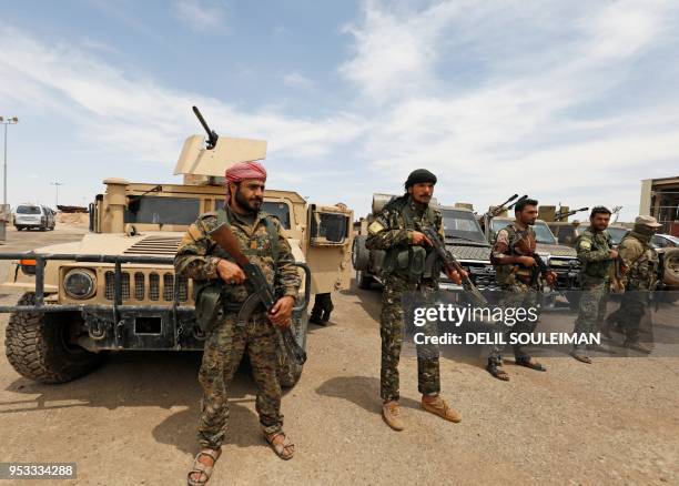 Members of the Syrian Democratic Forces gather at the al-Tanak oil field as they prepare to relaunch a military campaign against the Islamic State...