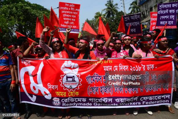 Bangladeshi garment workers and other labor organization members take part in a rally to mark May Day, International Workers' Day in Dhaka,...