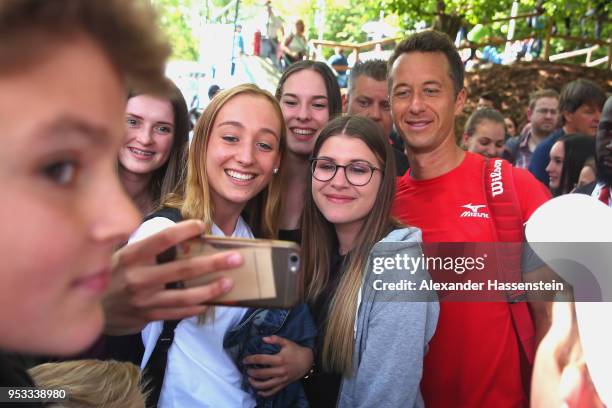 Philipp Kohlschreiber of Germany poses for pictures after his first round match against Ivo Karlovic of Croatia on day 4 of the BMW Open by FWU at...