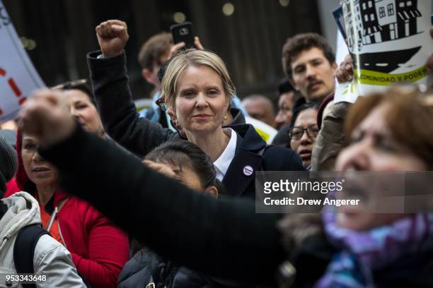 New York gubernatorial candidate Cynthia Nixon stands with activists as they rally against financial institutions' support of private prisons and...