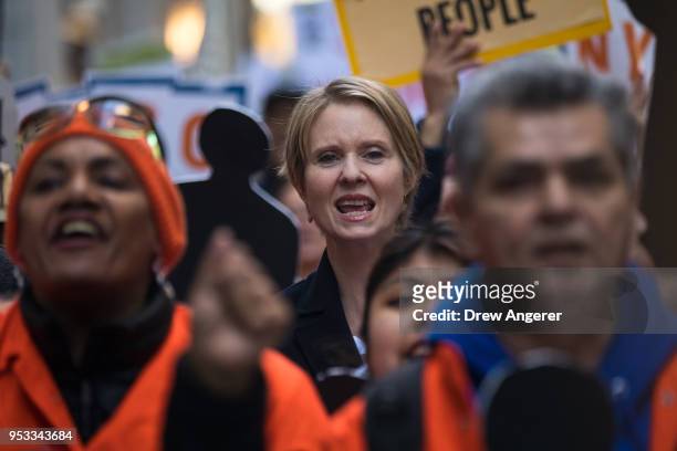 New York gubernatorial candidate Cynthia Nixon marches with activists as they rally against financial institutions' support of private prisons and...