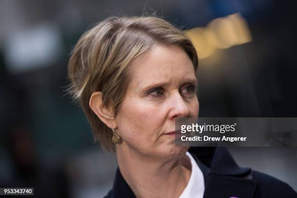 New York gubernatorial candidate Cynthia Nixon speaks with reporters following a rally against financial institutions' support of private prisons and...