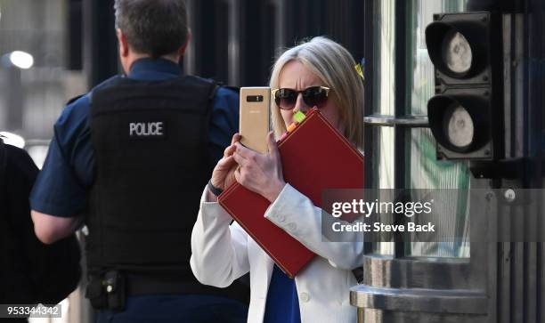 Liz Truss, Chief Secretary to the Treasury taking a picture on her phone as she attends the first cabinet meeting following the Re-Shuffle at Downing...