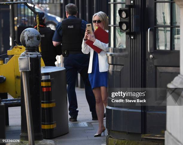 Liz Truss, Chief Secretary to the Treasury taking a picture on her phone as she attends the first cabinet meeting following the Re-Shuffle at Downing...