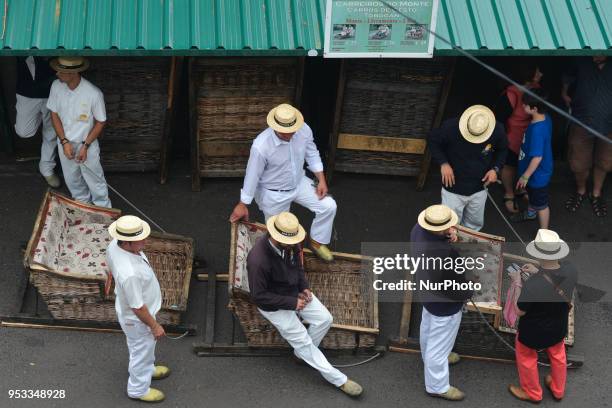 General view of the toboggan drivers in Monte, wearing the traditional uniforms, and awaiting for visitors to ferry them downhill at high speeds in...