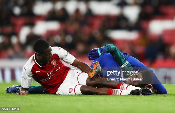 Charlie Brown of Chelsea FC collides with Joseph Olowu of Arsenal FC and Joao Virginia of Arsenal FC during the FA Youth Cup Final, second leg match...