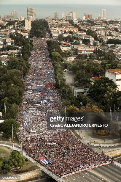 People march to Revolution Square in Havana to celebrate May Day, on May 1, 2018.