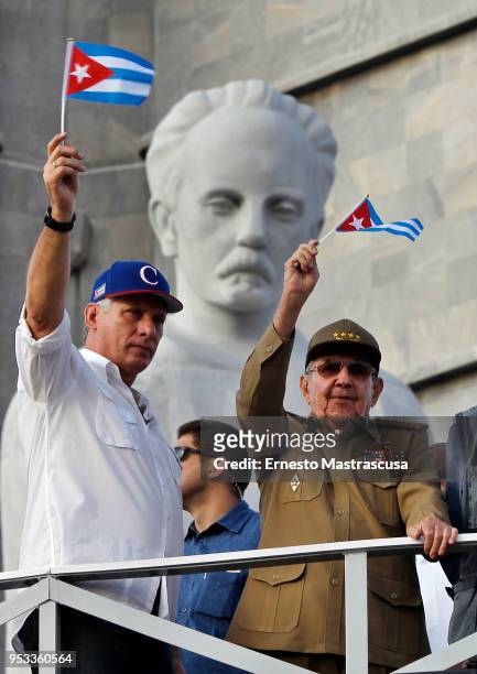 President of Cuba Miguel Díaz-Canel greets Cubans along with the current first secretary of the Communist Party of Cuba , Raúl Castro during a parade...