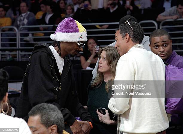 Snoop Dogg, Ellen Pompeo and Chris Ivery attend a game between the Cleveland Cavaliers and the Los Angeles Lakers at Staples Center on December 25,...