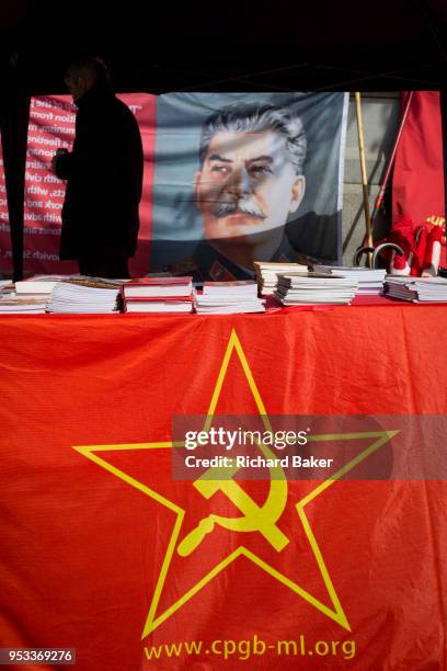Pamphlets and literature on a stall of the Communist Party of Great Britain gather in Trafalgar Square during the traditional May Day celebrations in...