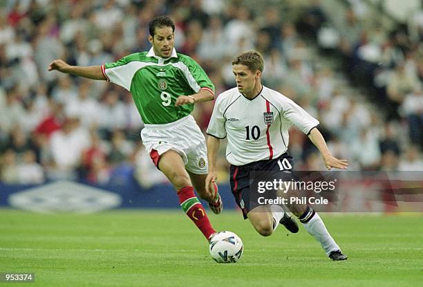 Michael Owen of England takes on Jose Abundis of Mexico during the International Friendly at Pride Park in Derby, England. \ Mandatory Credit: Phil...