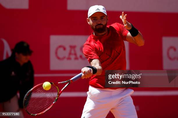 Carballes Baena from Spain returns a ball to Roberto Bjorn Fratangelo from USA during their Millennium Estoril Open ATP Singles 1st round tennis...