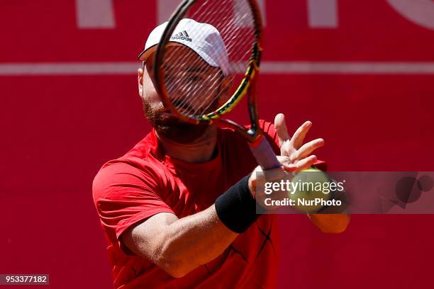 Carballes Baena from Spain returns a ball to Roberto Bjorn Fratangelo from USA during their Millennium Estoril Open ATP Singles 1st round tennis...