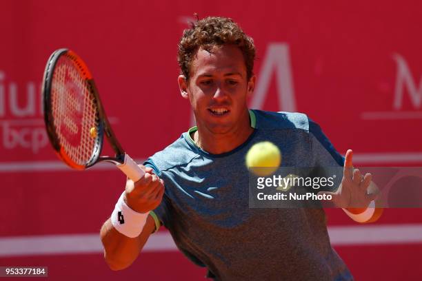 Bjorn Fratangelo from USA returns a ball to Roberto Carballes Baena from Spain during their Millennium Estoril Open ATP Singles 1st round tennis...