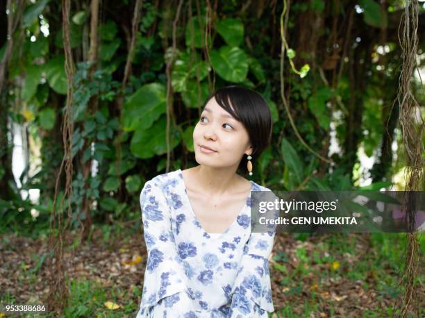 woman who relaxes under the big tree - pale complexion stock-fotos und bilder