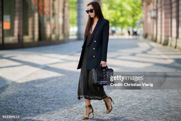 Nadja Ali wearing Lala Berlin dress, Jimmy Choo heeled sandals, Balmain for H&M blazer, Liebeskind Berlin bag, Celine sunglasses is seen on May 1,...