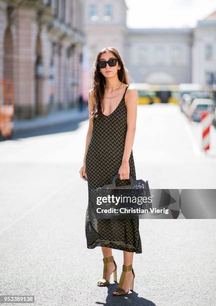 Nadja Ali wearing Lala Berlin dress, Jimmy Choo heeled sandals, Liebeskind Berlin bag, Celine sunglasses is seen on May 1, 2018 in Berlin, Germany.