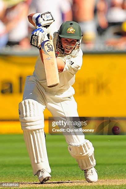 Mike Hussey of Australia plays an off drive during day one of the First Test match between Australia and Pakistan at Melbourne Cricket Ground on...