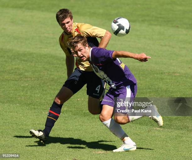 Adam Taggart of the Glory and Jon Griffiths of the Jets contest the ball during the round 17 National Youth League match between the Perth Glory and...
