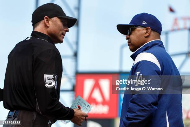 Dave Roberts of the Los Angeles Dodgers talks to umpire Dan Iassogna during the sixth inning against the San Francisco Giants at AT&T Park on April...