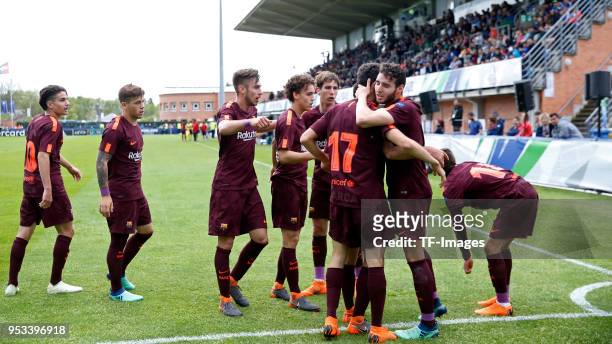 Alejandro Marques of Barcelona celebrates after scoring his team`s first goal with team mates during the UEFA Youth League Final match between...